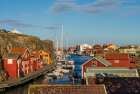 Sweden-Bohuslan-Smogen-Smogenbryggan-antique boat houses and fishing shacks Art Print